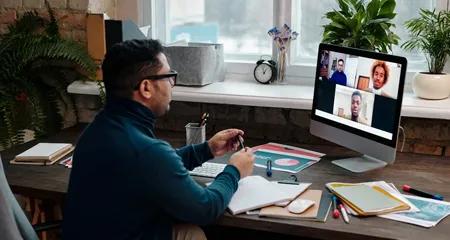Person in video conference call on computer