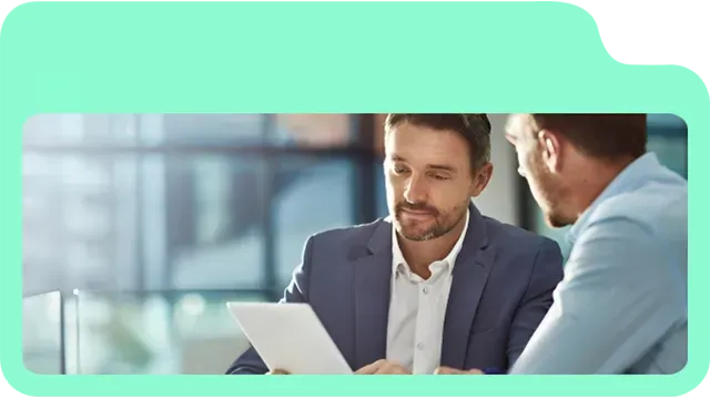 Two professionals discussing client portal features